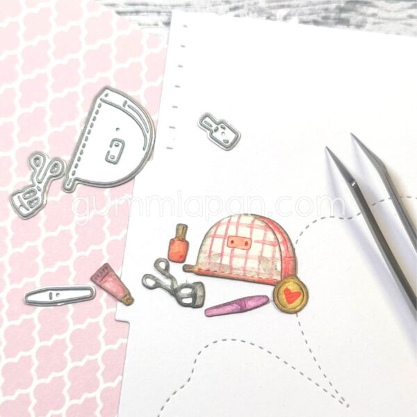 Gummiapan Dies Toalettmappe med Sminke